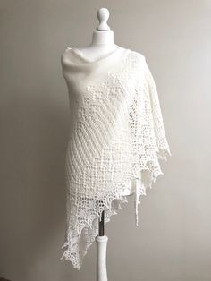 Hand knitted wedding shawl in pure merino wool. The Shawl is very soft and warm. You can wear it on any occassion. The Shawl looks great in any style you wear it. It can be a beautiful gift for a mom, wife, grandmother... Made to order. The shawl can be made in 10 days. Color - white Shape - triangle Fiber - merino wool 100% Measurements: lenght - 120 cm ( 47 inches) wide - 240 cm ( 94,5 inches) Care - hand wash in cool water and lay flat to dry, or dry clean. Elegant Alpaca Shawl, Elegant Hand Knitted Cream Shawl, White Crochet Scarf One Size, Elegant Knitted Shawl Scarf, Elegant Hand Knitted Shawl Scarf, Elegant Hand Knitted Alpaca Shawl, Hand Knitted White Shawl For Wedding, White Hand Knitted Shawl For Wedding, Elegant Hand-knitted Shawl Scarf