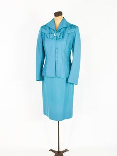 "~ 1950s Gorgeous turquoise blue wool crepe suit ~ This beautiful suit was my Mother's and only worn a few times. ~ Remembering Mom fondly as I'm finally ready to let the suit go ~ Matching decorative bow with rhinestones ~ Both front sides have sewn down pleats ~ Interesting collar & fitted waist ~ 4 covered buttons ~ Jacket has blue silk crepe lining ~ Skirt is half lined in taffeta ~ 7\" side metal zipper ~ Excellent Label: Lilli Ann, Luxurious Fabric of Paris, Loomed in Paris Jacket Bust Remembering Mom, Layered Ruffle Dress, Lilli Ann, Wool Crepe, Beautiful Suit, 60s Dress, Brown Sweater, Blue Silk, Blue Wool