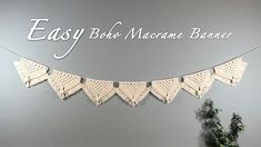 an easy bolo macrame banner hanging on a wall