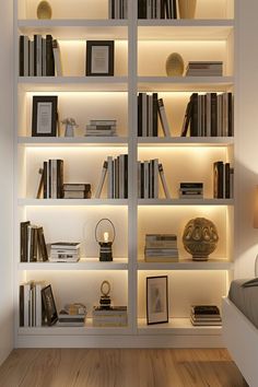 a white book shelf filled with lots of books