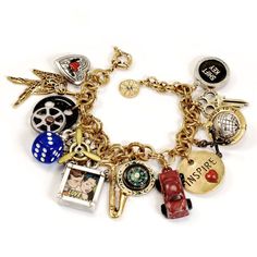 "Straight out of a 1950s American junk drawer, the charms on this statement bracelet are miniature icons of mid-century American culture. It is the very definition of 'conversation piece.' Charms are dimensional, chunky and most have movement. Each expresses the fun, imagination, hopes and aspirations of the 20th century. Adjustable to fit 6-1/2 to 8\" wrist. Double rolo chain bracelet. Mixed metals. Cast and fabricated in our Los Angeles studio. Arrives ready to gift in attractive jewelry box. Retro Americana, Flower Cuff Bracelet, Sterling Silver Charm Bracelet, Rainbow Bracelet, Sweet Romance, Funky Jewelry, Jewelry Lookbook, Silver Charm Bracelet, Statement Bracelet