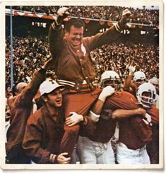 an old photo of a football player being carried on his shoulders