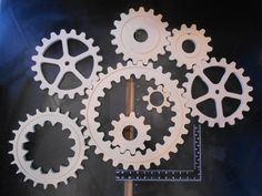 four white gears on a black background