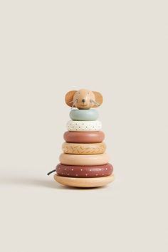 a stack of wooden toy animals sitting on top of each other