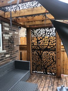 a wooden deck with an iron screen on it