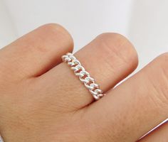 Bold and beautiful. This flexible curb chain ring is handcrafted with high-quality sterling silver material and made to order just for you. Can be worn when washing hands or showering! Wear this chain ring alone or stack it with other rings for a layered looked! Great for gifting. Handmade in Los Angeles, CA! Packaging:  Comes in a gift box, ready for gift-giving! Dimensions: Width: 4mm  Thickness: 1.1mm Material: Sterling Silver / 925 Benefits of Sterling Silver / 925 Jewelry: 1. It's hypoaller Luxury Silver Chain Link Ring, Silver Chain Ring, Chain Link Ring, Link Ring, Washing Hands, Ring Chain, Stack Ring, White Gold Chains, Linking Rings