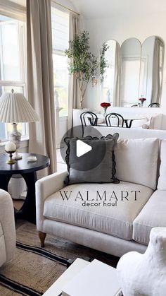 a living room filled with furniture and mirrors