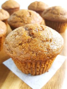 several muffins sitting on top of a wooden table