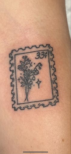 a stamp with some flowers in it on someone's arm and the word free