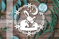 the paper cut rabbit is surrounded by leaves