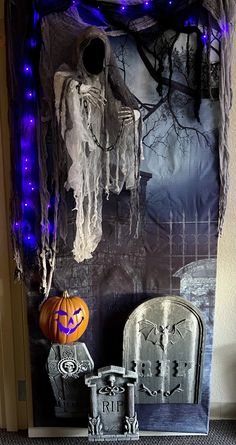 a halloween scene with tombstones and decorations