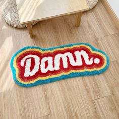 a rug with the word damn written on it