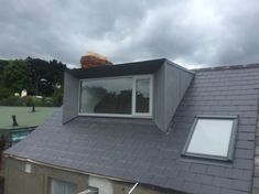 the roof of a house with a skylight on it