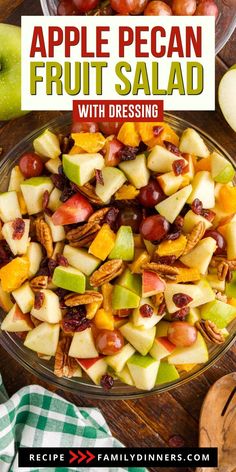 an apple pecan fruit salad with dressing in a glass bowl on top of a wooden table