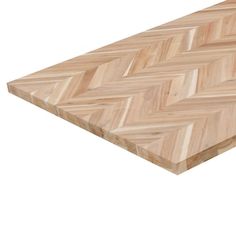 a wooden cutting board with an angled chevron pattern on the top and bottom edge