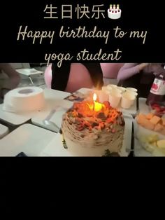 a birthday cake sitting on top of a table next to other plates and bowls filled with food