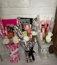 two vases filled with different types of cosmetics