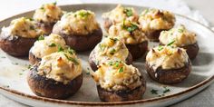 stuffed mushrooms topped with mashed potatoes on a plate