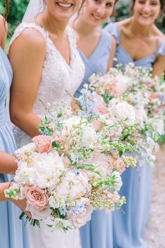 the bride and her bridesmaids are holding their bouquets