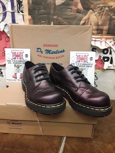 These are a rather unique pair of Dr MARTENS shoes. They are finished in a plum coloured gunmetal leather. It has a shimmer look to it and is very pleasing on the eye. These are a 4 eyelet shoe with a stitched toe cap. They are not a steel cap shoe though. They have a dyed black wedged sole u it and trademarked yellow stitching.  These are a uk size 4, European 37,ladies USA 6. Doc Marten Oxford, Dr Martens Shoes, Plum Color, Martens Shoes, Dr. Martens, Boot Shoes Women, Plum, Oxford Shoes, Womens Boots