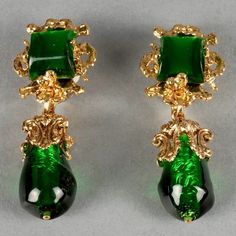 Features: - 100% Authentic GAVILANE. - Green glass paste drop/ dangling earrings encaged in sculptural gilt metal . - Clip back earrings. - Signed GAVILANE.  - Excellent vintage condition. Measurements: Height: 2.52 inches (6.4 cm) Width: 0.98 inch (2.5 cm) Weight per Earring: 20 grams * This will be shipped via DHL Express with tracking number. Please convo me for any queries and additional photos. Thank you for visiting. Other Fees that buyers need to know: Please make sure you know and unders Green Metal Evening Earrings, Green Metal Earrings For Evening, Evening Gold Jewelry With Glass Material, Green Teardrop Clip-on Earrings For Formal Occasions, Vintage Gold Glass Earrings, Formal Glass Drop Earrings, Glass Drop Earrings For Formal Occasions, Green Dangle Earrings Costume Jewelry, Green Dangle Costume Jewelry Earrings