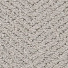 an up close shot of the texture of a carpet with white and gray colors on it