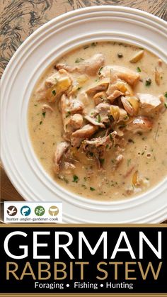 german rabbit stew with potatoes and herbs in a white bowl on top of a wooden table