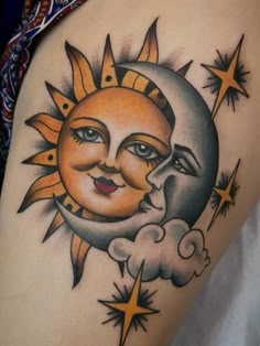 a sun and moon tattoo on the back of a woman's thigh, with stars around it