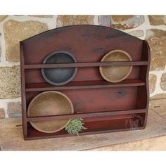 a wooden shelf with three bowls on it