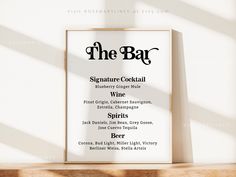 the bar menu is displayed in front of a white wall with sunlight streaming through it