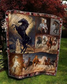 a quilt with horses on it sitting in the grass