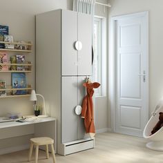 a child's room with pink and white furniture, bookshelves and toys