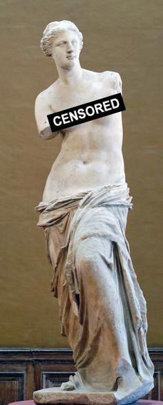 a statue with a sign that reads censored on it's back end