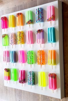 an ice cream display with colorful pops and sprinkles