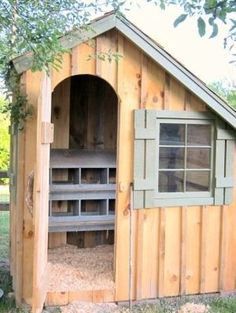 a chicken coop built into the side of a house with windows and doors on each side