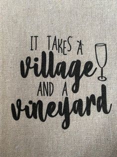 it takes a village and a vineyard tote bag with wine glass on the front