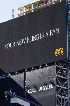 a large billboard on the side of a building that says your new fling is a fan