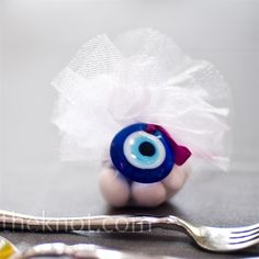 an eyeball and fork on a table