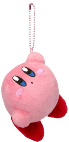 a pink stuffed animal hanging from a metal ball chain with eyes on it's head