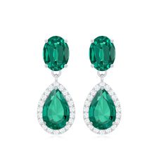 Product Details This Drop Earrings embellished with Pear and Oval Shape Lab Created Emerald in Prong Setting encircled with Round Shape Diamond gemstones. This drop dangle earrings crafted in a Solid Gold. A perfect Cocktail Earrings for your girl. Product Information SKU SHP-EARRINGS042171549 Weight 2.76 gm (Approximate) LAB CREATED EMERALD INFORMATION No.of Stones 4 Pieces Total Weight 3.80 Carat (Approximate) Dimension(approx) Oval-5X7 mm-2 PcsPear-6X8 mm-2 Pcs Color Green Cut Brilliant Shape Oval, Pear Setting Type Prong-Setting Quality Grade AAAA DIAMOND INFORMATION No.of Stones 40 Pieces Total Weight 0.40 Carat (Approximate) Dimension(approx) Round-1.10X1.10 mm-40 Pcs Color HI Cut Brilliant Shape Round Setting Type Prong-Setting Quality Grade SI View More Product Parent Collection Ha Cocktail Earrings, Lab Created Emerald, Perfect Cocktails, Drop Dangle Earrings, Earring Crafts, Your Girl, Diamond Gemstone, Oval Shape, Round Shape