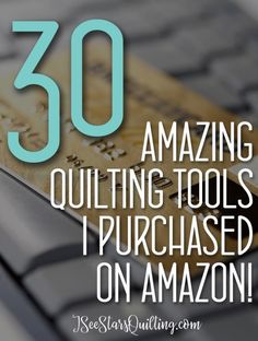 a credit card sitting on top of a computer keyboard with the words 30 amazing quilting tools i purchased on amazon