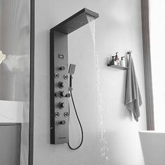 a shower head with thermostaer and faucet in black and white