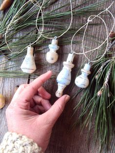 Looking for that perfect touch of handmade for your primitive Christmas decor? Try a set of four wooden spindle ornaments! These distressed wooden spindle decorations have been hand painted in an assortment of ivory, taupe, and grays, hand-distressed to give them an aged appearance, and finally sealed with a satin sealant for protection. Perfect for a rustic-primitive Holiday or folksy farmhouse decor! Spindles measure from 1-1/2 to 2-3/4 inches in length. *This item will be made to order. Pleas Spindle Ornaments, Peg Ornaments, Finial Ornaments, Spindle Crafts, Shabby Farmhouse, Primitive Christmas Decor, Wood Engagement Ring, Christmas Hostess, Folk Decor