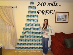 a woman standing in front of a large stack of toilet paper with the words 240 rolls free