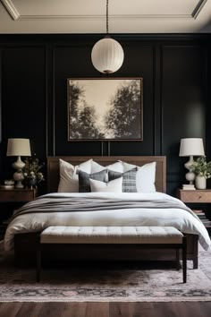 a bedroom with black walls and white bedding, two lamps on either side of the bed