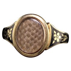 Beautiful Antique Victorian 18K Yellow Gold Enamel Hair Mourning Ring. This amazing ring has pristine enameling and the hair is still intact inside the glass. It has flower designs on the side of the ring without any damage which is rare. The inside of the ring is hallmarked. Item #R0926 Metal: 18K Yellow Gold. Weight: 4 Grams Ring Size: 8 Measurements: Top measures 13 mm wide and band measures 2.8 mm wide. Measurement from finger to top of ring: 3.75 mm Layaway: For your convenience, we will be Luxury Antique Engraved Enamel Ring, Victorian Hair Jewelry, Sentimental Jewellery, Art Nouveau Pendant, Historical Jewellery, Jewelry Picture, Hair Rings, Gold Enamel, Jewelry Inspo