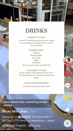 the menu for drinks and other things is displayed in front of a table with white linens