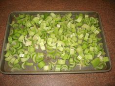 chopped celery sitting on top of a metal pan