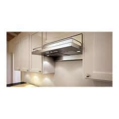 a kitchen with white cabinets and stainless steel range hood