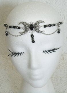 "This beautiful circlet has black Czech glass beads, black pearl beads, sterling silver plated filigree beads, sterling silver plated accents, sterling silver plated chain and sterling silver plated crescent moon pendant with black onyx setting. An elegant headpiece. 20\" long can be adjusted to 24\". Lobster clasp." Victorian Silver Costume Jewelry, Adjustable Silver Gothic Jewelry, Adjustable Gothic Silver Jewelry, Elegant Beaded Halloween Jewelry, Elegant Beaded Jewelry For Halloween, Black Crescent Jewelry For Festival, Gothic Beaded Wedding Jewelry, Bohemian Black Metal Body Jewelry, Black Crescent Metal Jewelry